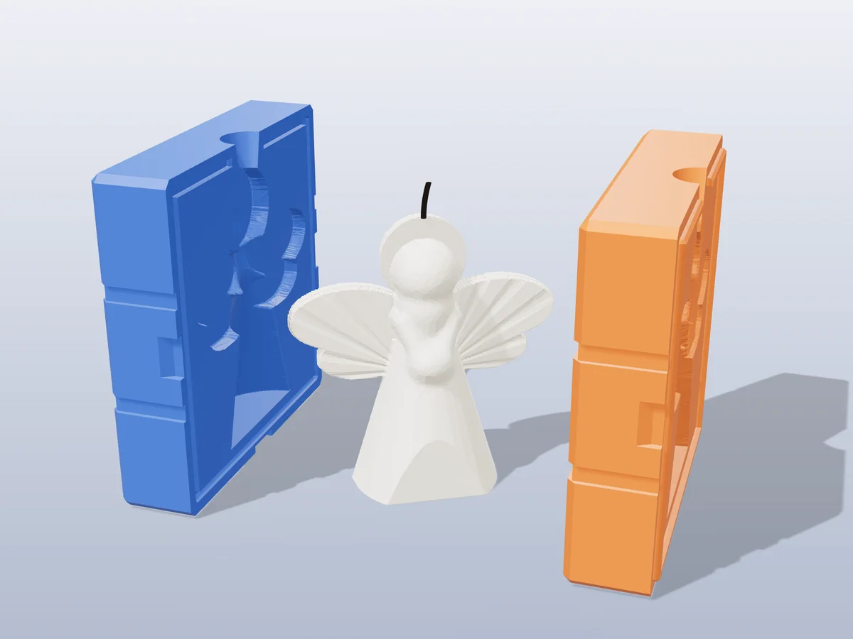 3D render of an ivory angel candle with spread wings and a halo between the two printed halves of its rigid blue and orange mold