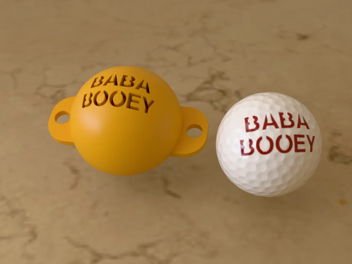 3D render of an amber 3D-printed golf ball stencil with BABA BOOEY cut through it, sitting on a golf ball, next to a ball marked with BABA BOOEY in red