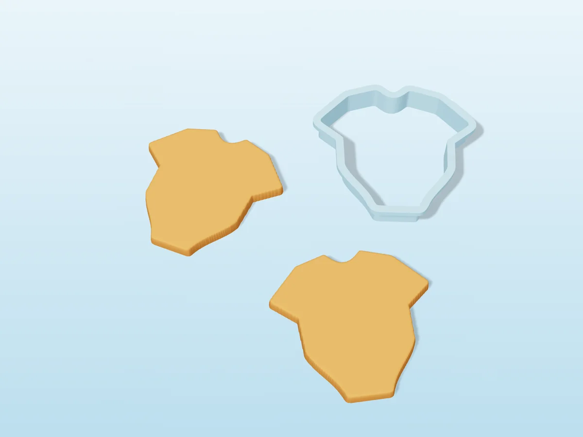 3D render of a pale blue 3D-printed baby onesie cookie cutter next to two golden baked cookies in the same shape