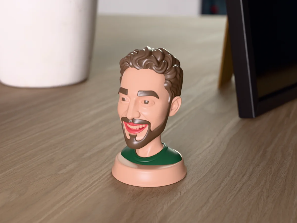 3D render of a 3D-printed bust of a smiling guy with curly brown hair and a full beard, painted in 5 colours, on a table