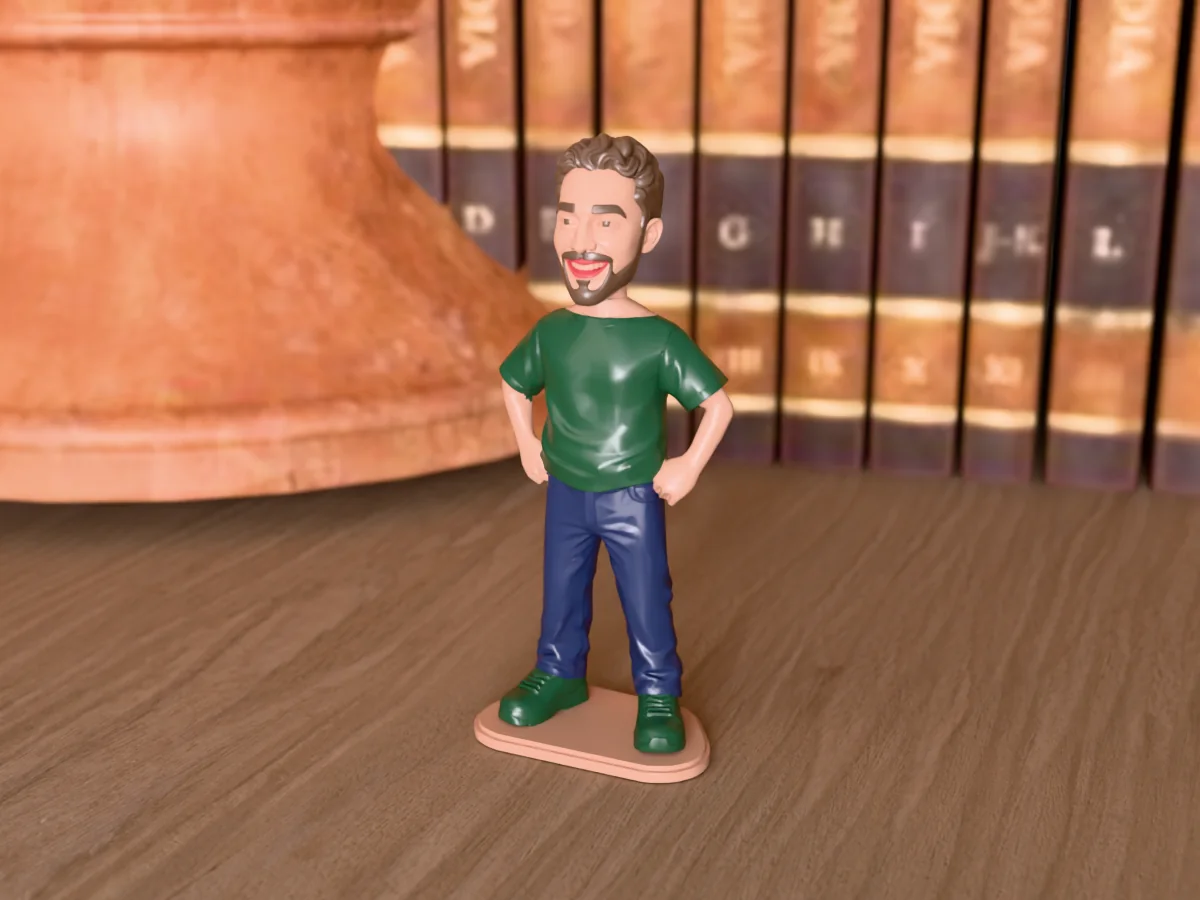 3D render of a 3D-printed mini figure of a smiling guy with curly brown hair and a full beard, painted in 5 colours, on a table