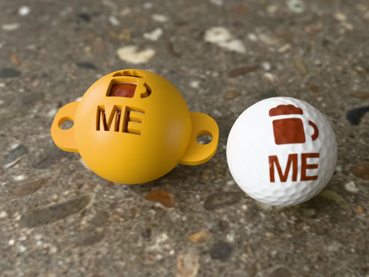 3D render of an amber 3D-printed golf ball stencil with a beer mug over ME cut through it, sitting on a golf ball, next to a ball marked with a beer mug over ME in amber