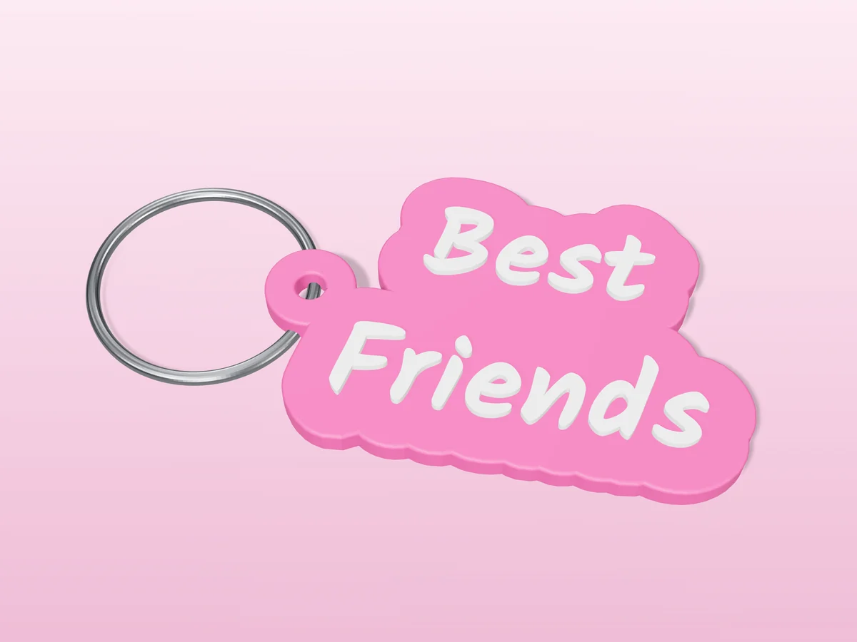 3D render of a pink and white 3D-printed Best friends keychain with a steel split ring through its hole
