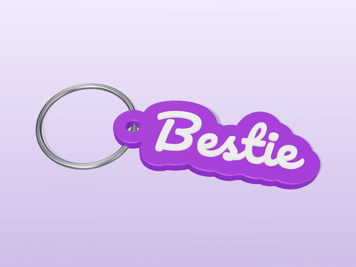 3D render of a purple and white 3D-printed Bestie keychain with a steel split ring through its hole