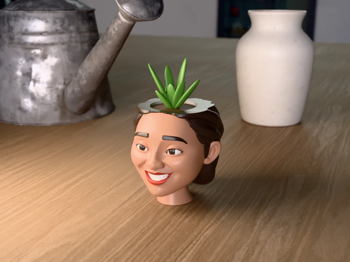 3D render of a 3D-printed head planter of a smiling woman with a dark bob, painted in 6 colours, on a table