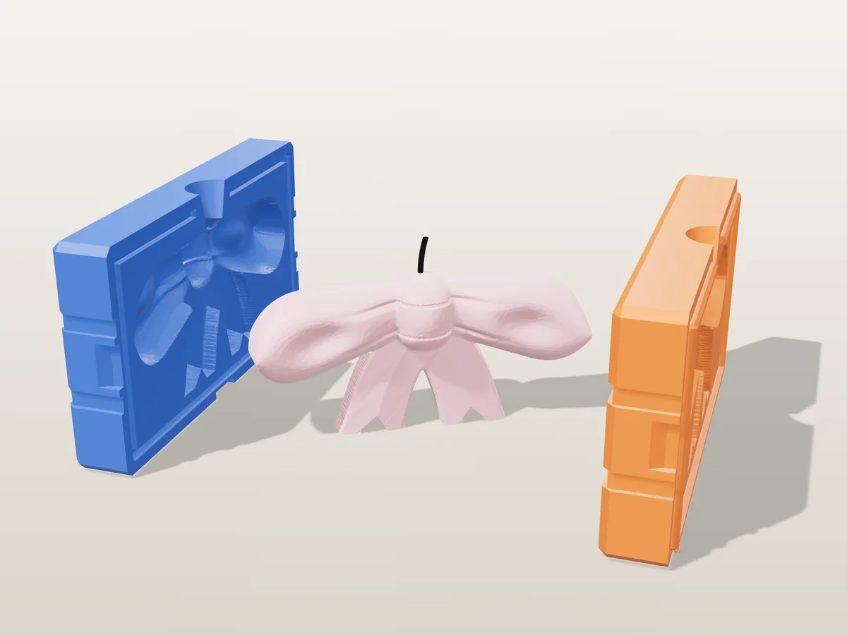 3D render of a blush pink ribbon bow candle between the two printed halves of its rigid orange and blue mold