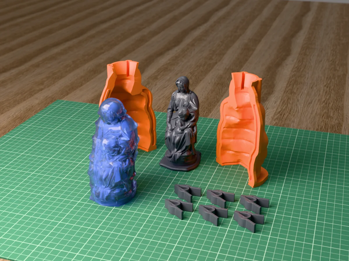 3D render of the Bruges Madonna master on its printed charcoal base between the two orange hugging-shell halves, with the six printed clamps and the cured translucent blue silicone mold in front