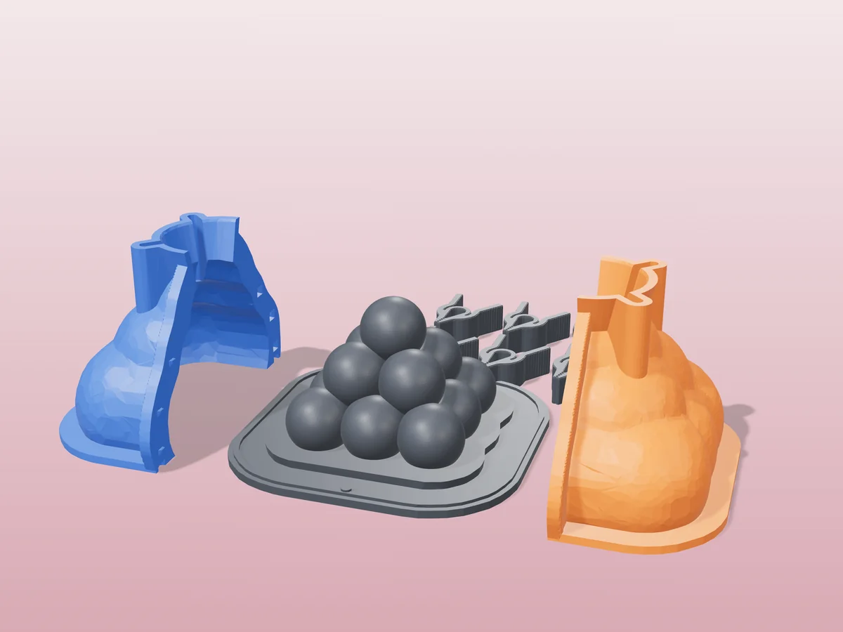 3D render of the bubble pyramid master fused on its printed charcoal base, between the orange and blue hugging shell halves