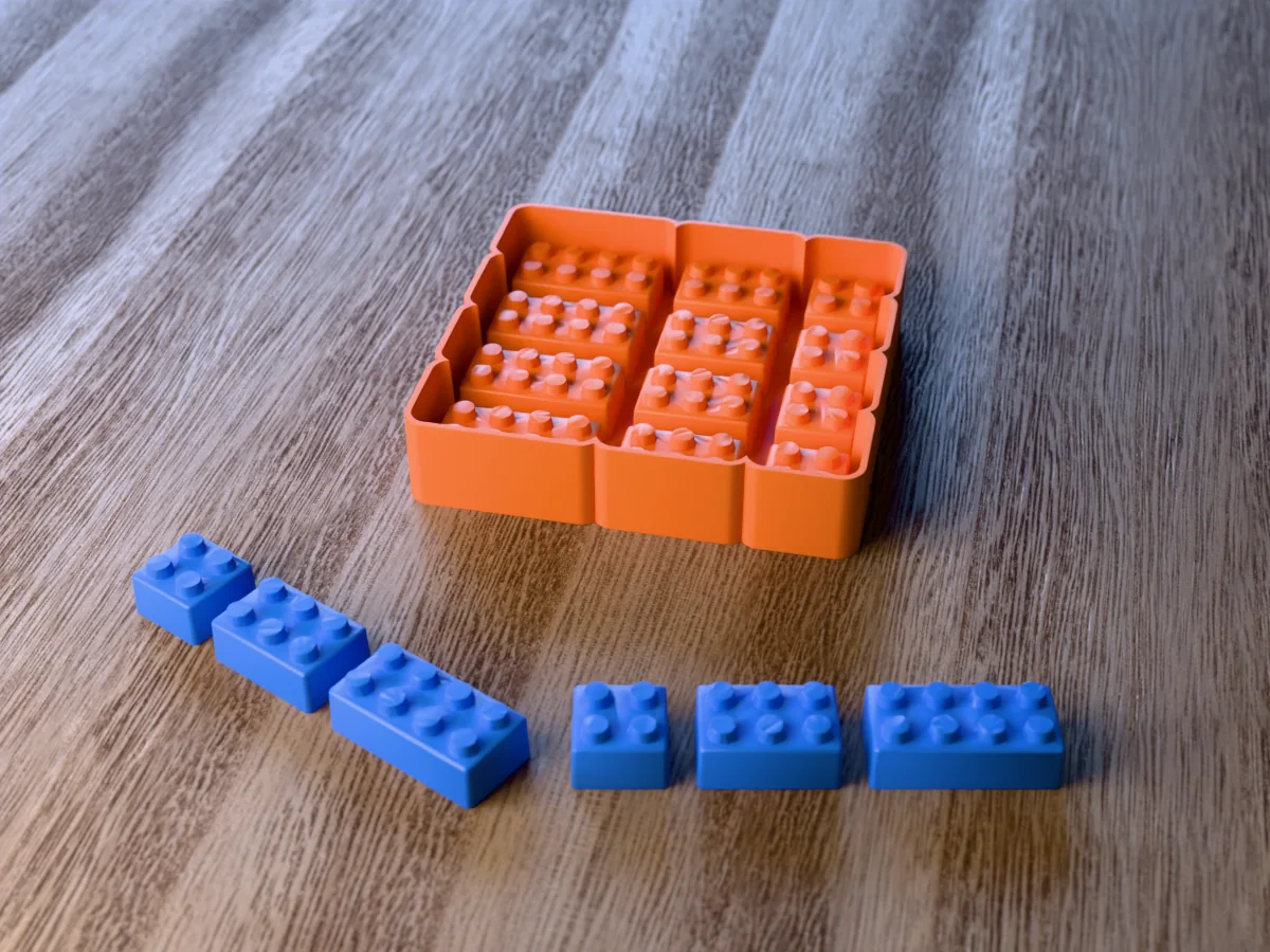 3D render of the printed caster for a twelve-cavity building brick crayon mold, with six blue toy brick crayons with round studs in 2x2, 2x3 and 2x4 sizes in front