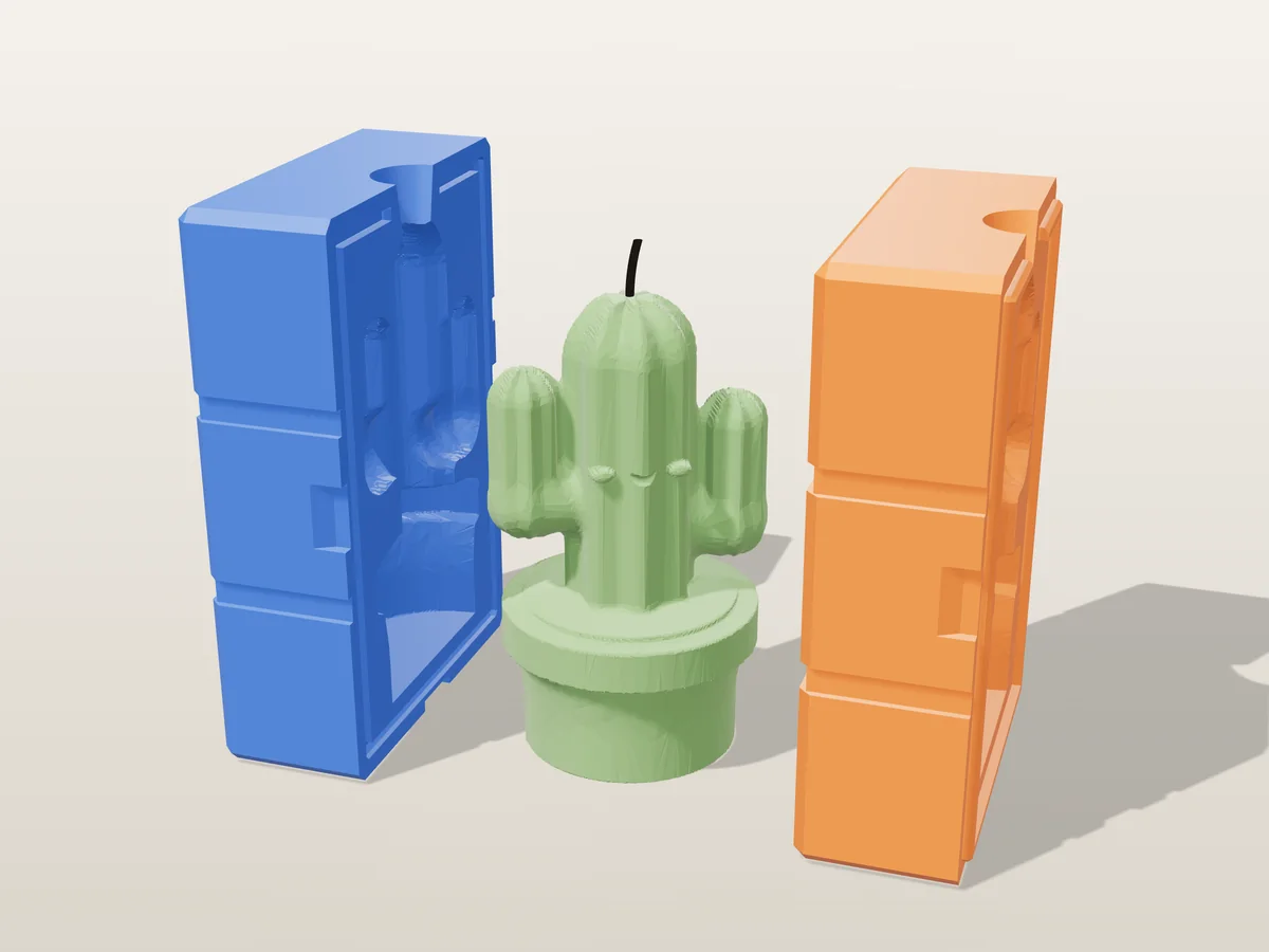 3D render of a green cactus candle with raised arms and a smile in a flowerpot between the two printed halves of its rigid blue and orange mold
