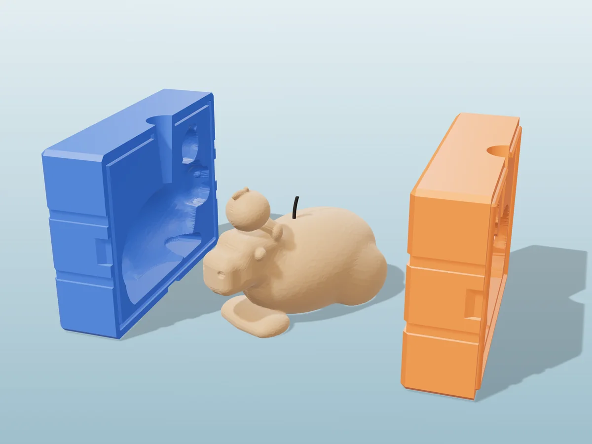 3D render of a tan capybara candle with an orange on its head between the two printed halves of its rigid blue and orange mold