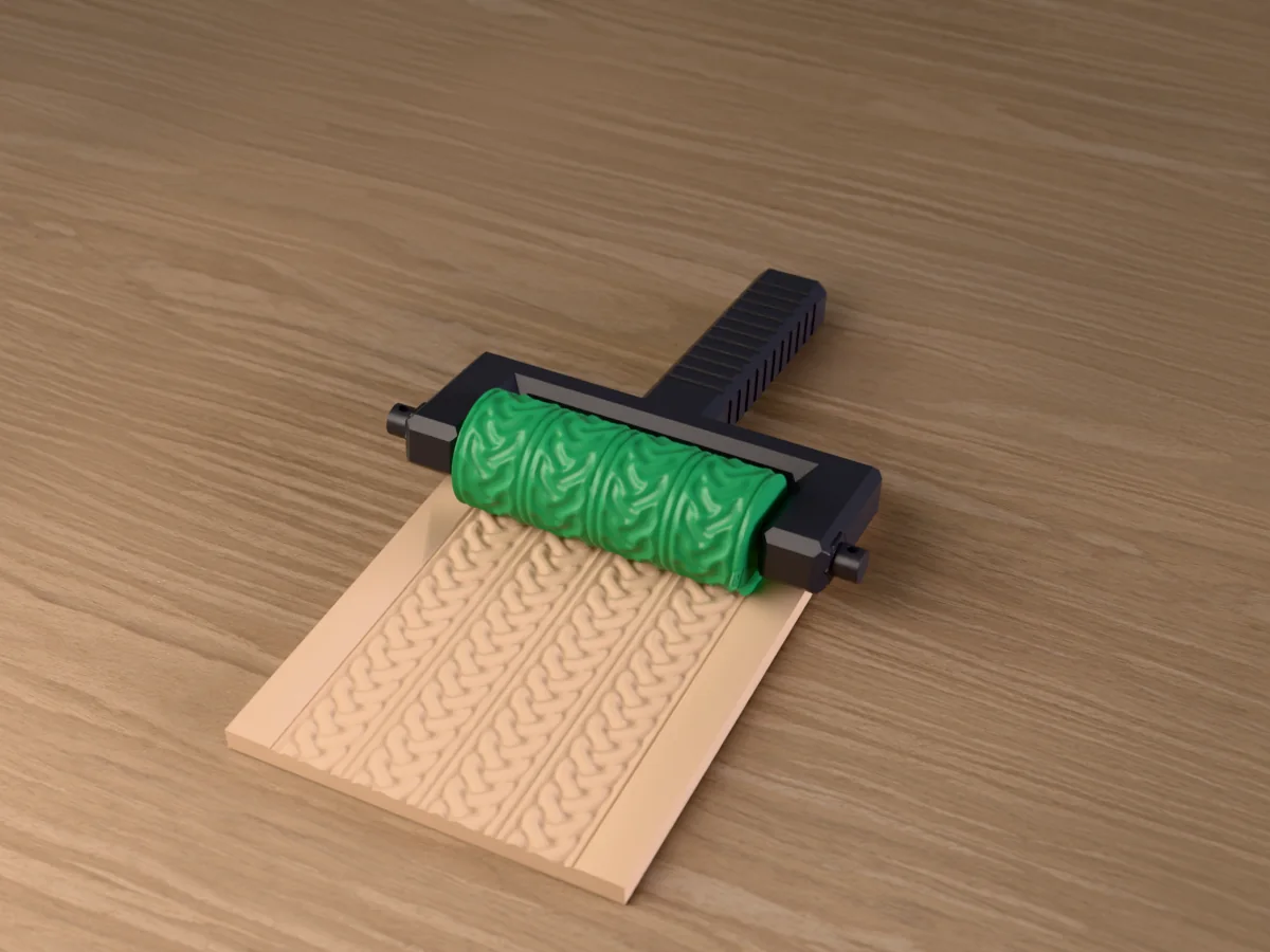 3D render of the printed celtic knot band texture roller in its dark fork handle, resting on a slab of clay it has pressed with Celtic knotwork bands