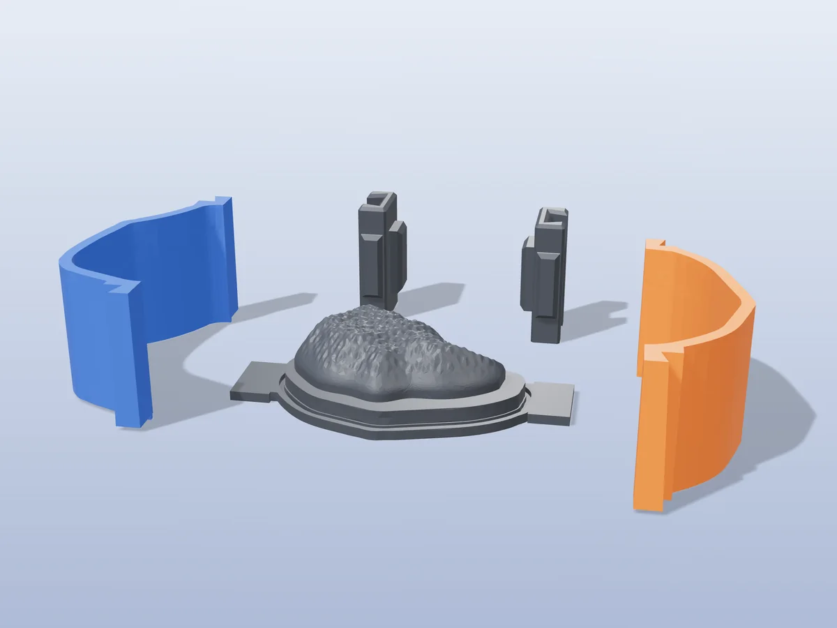 3D render of the chicken nugget soap master fused on its printed charcoal base, between the orange and blue walls, with the charcoal clamps behind