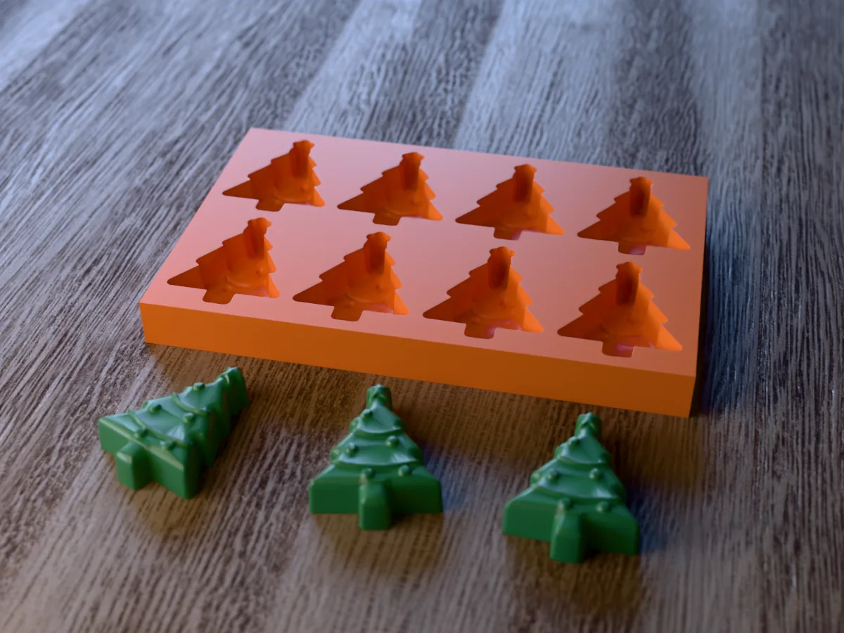 3D render of a printed orange tray with eight Christmas tree cavities, and three green Christmas tree wax melts with garlands and baubles in front