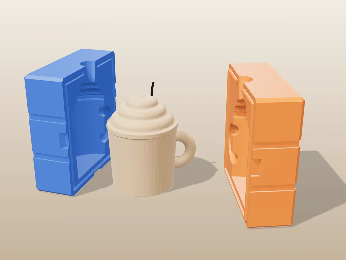 3D render of a coffee mug candle with a handle and whipped cream between the two printed halves of its rigid blue and orange mold