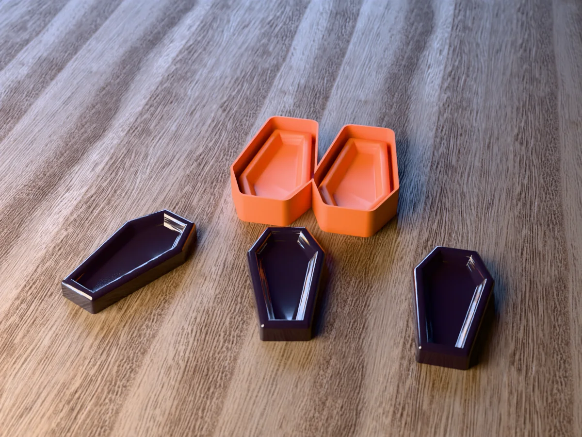 3D render of the printed caster for a two-coffin silicone tray, with three glossy black resin coffin trinket dishes in front
