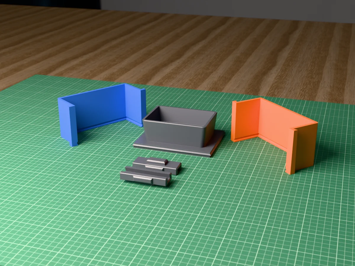 3D render of the rectangular bonsai pot master fused on its printed base, between the blue and orange box walls, with the two clamps in front