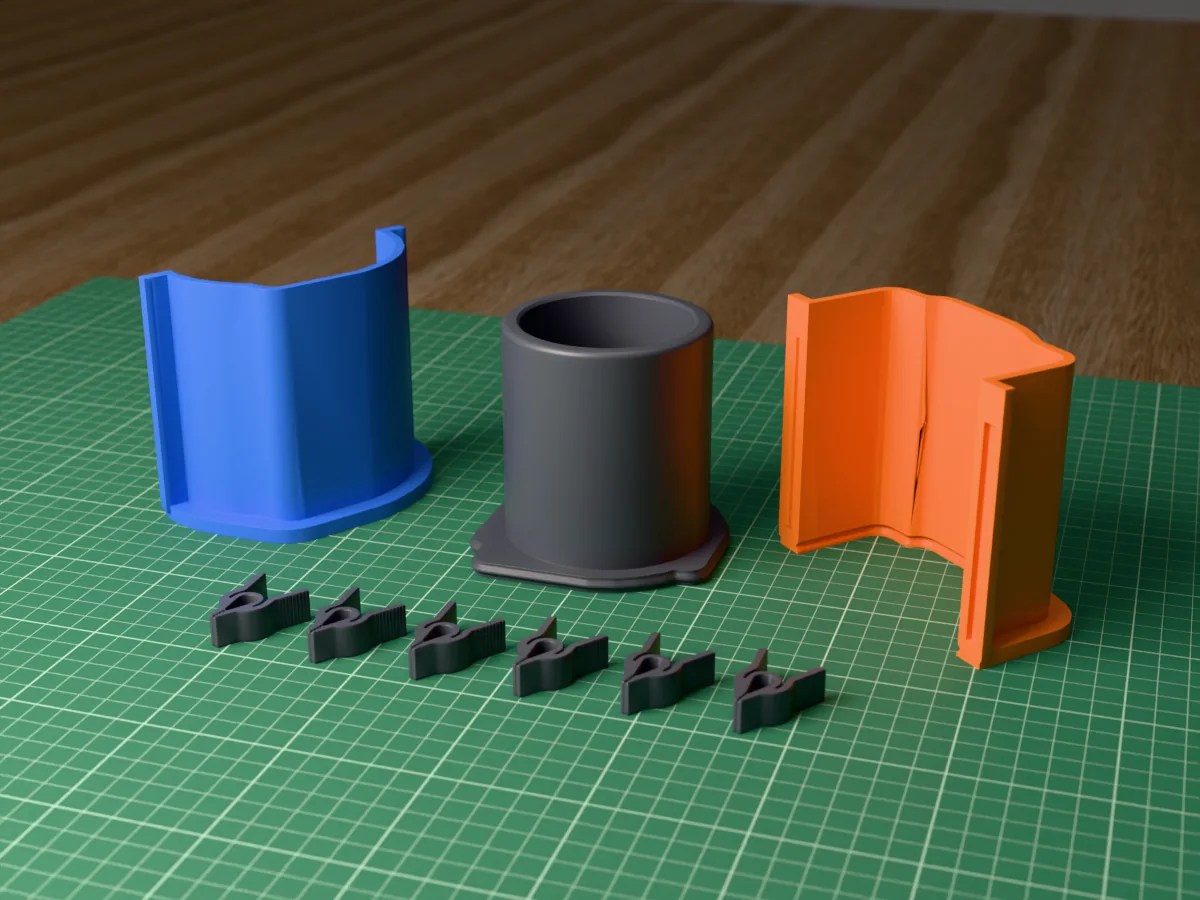 3D render of the straight candle jar master fused on its printed charcoal base, between the orange and blue shell halves, with the charcoal clamps behind