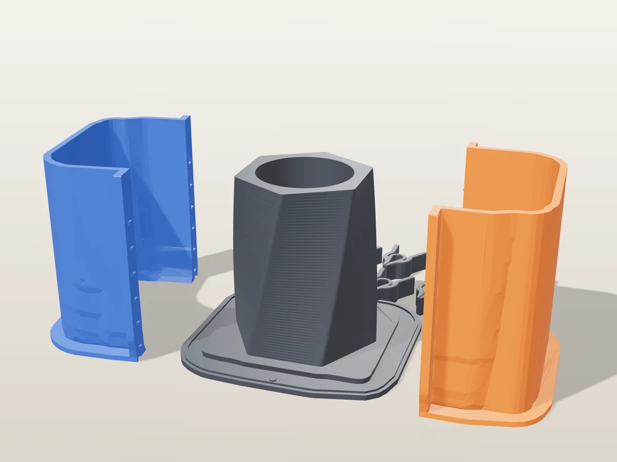3D render of the twisted hexagonal pen holder master fused on its printed charcoal base, between the orange and blue shell halves, with the charcoal clamps behind