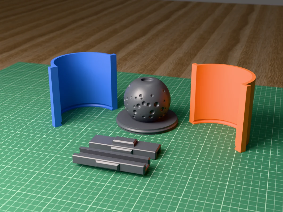 3D render of the porous lava stone incense sphere master covered in round pores, fused on its printed charcoal base between the orange and blue round walls, with the charcoal clamps in front