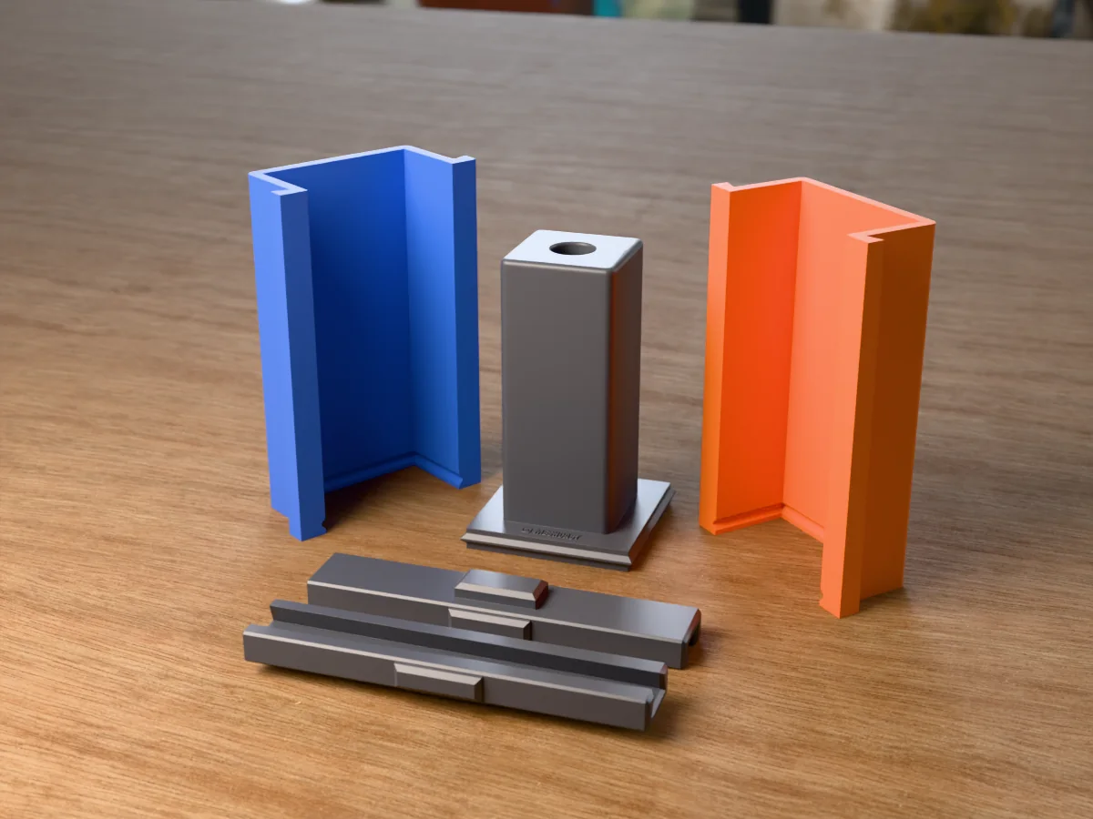 3D render of the square concrete bud vase master with its test tube hole, fused on its printed charcoal base between the orange and blue walls, with the charcoal clamps in front