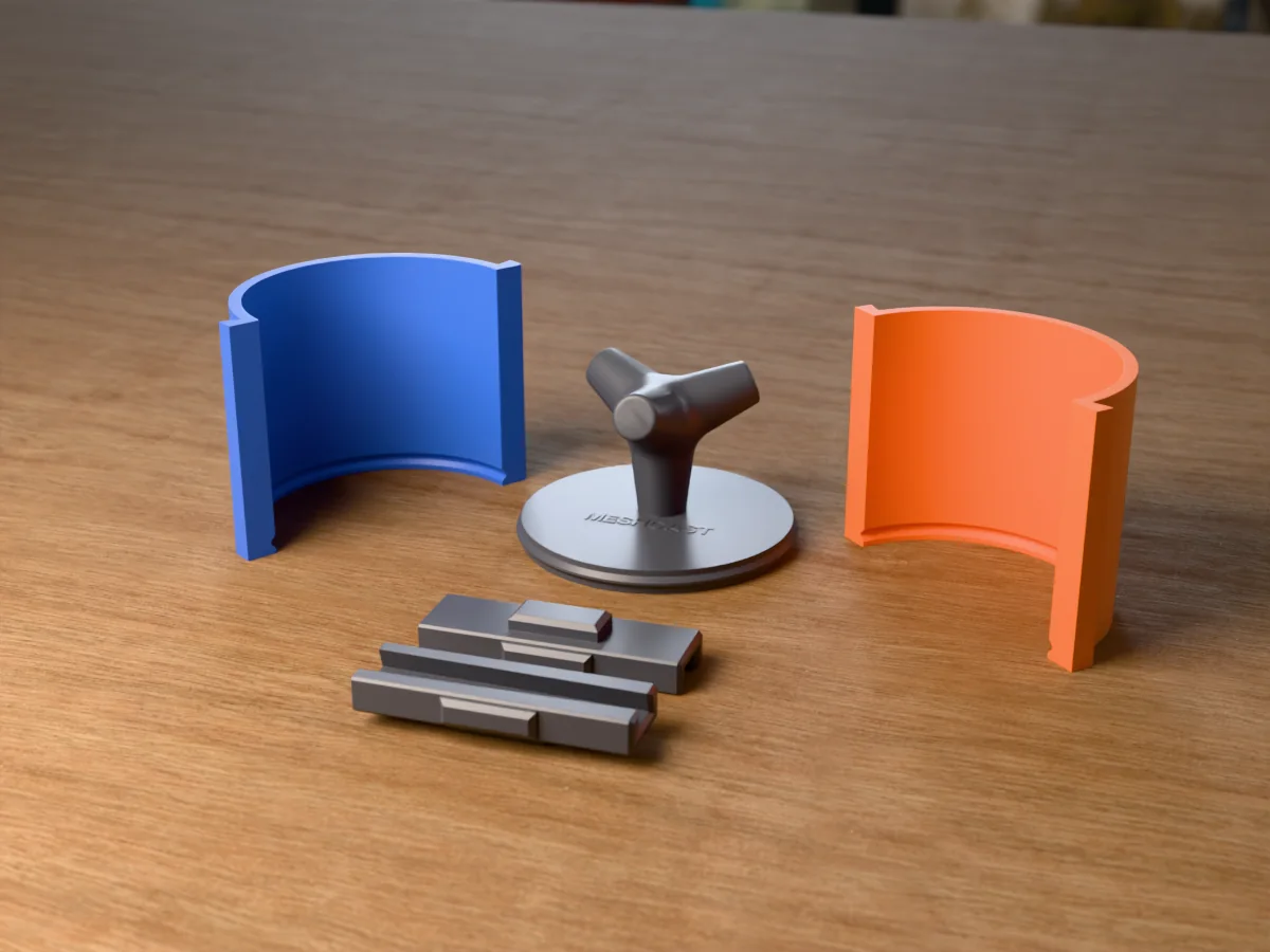 3D render of the concrete tetrapod master standing on one leg on its printed charcoal base, between the orange and blue round walls, with the charcoal clamps behind