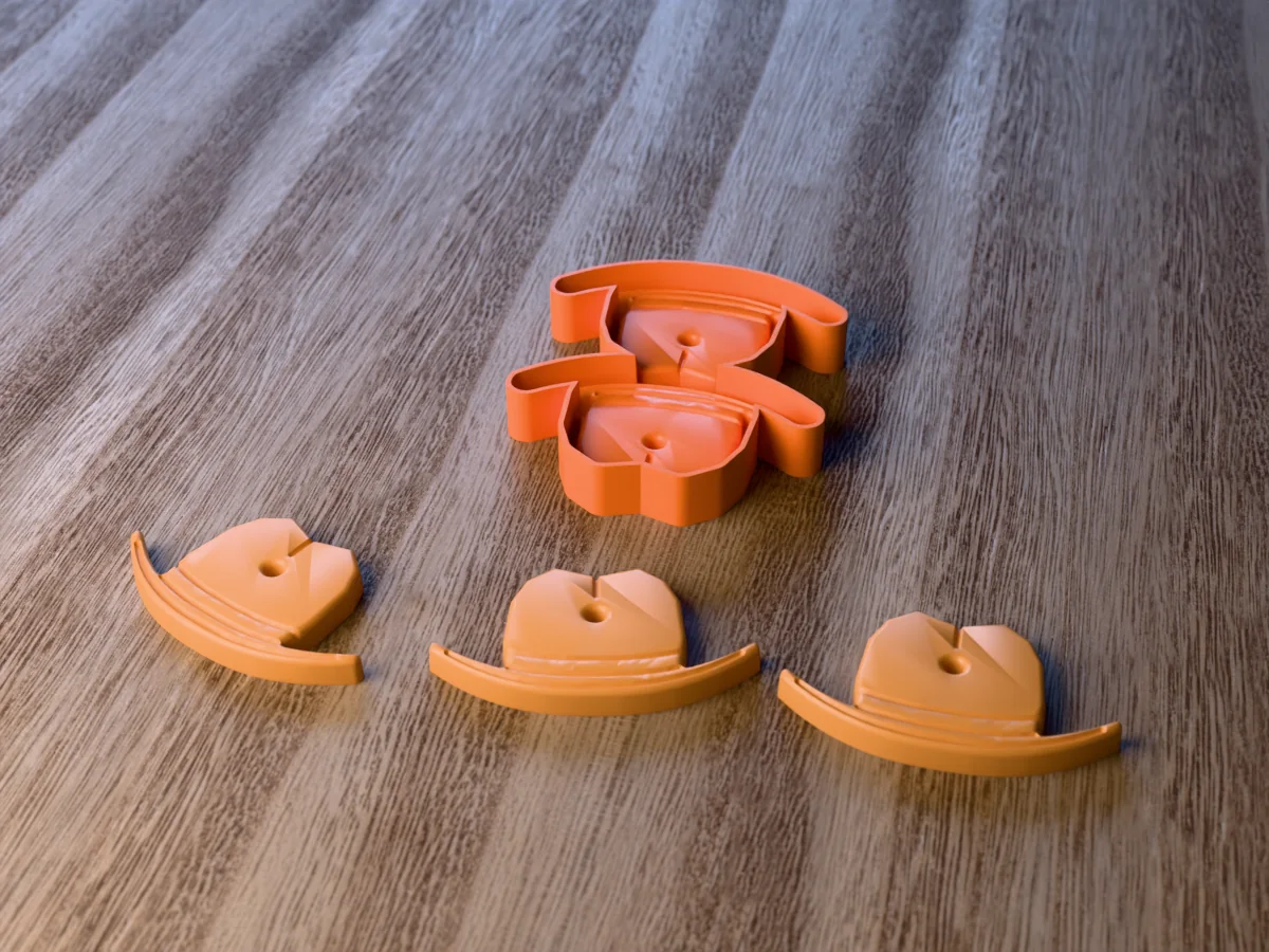 3D render of the printed caster for a two-cavity cowboy hat freshie mold, with three tan cowboy hat car freshies with a hat band in front