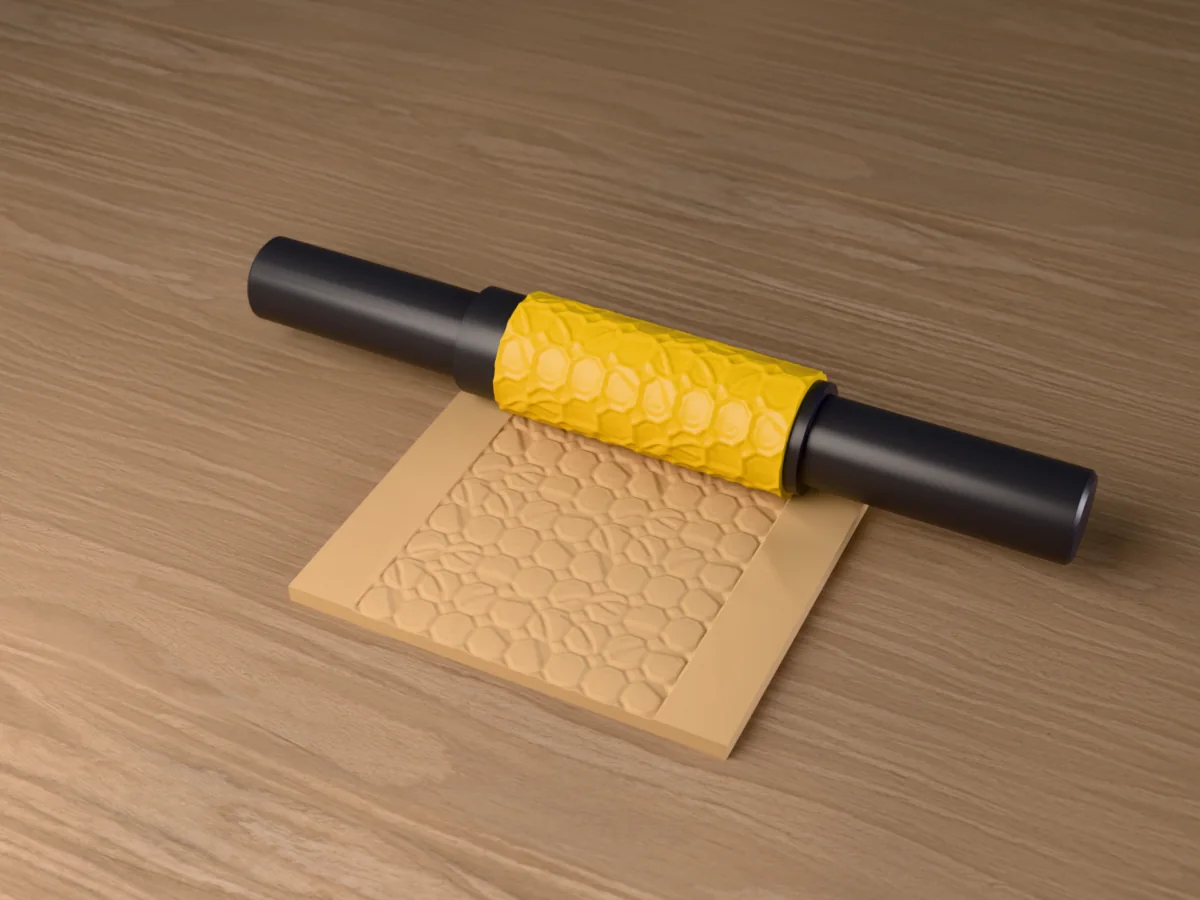 3D render of the printed cracked temple floor textured rolling pin, its patterned sleeve between two dark handles, resting on a slab of clay it has pressed with a cracked temple floor