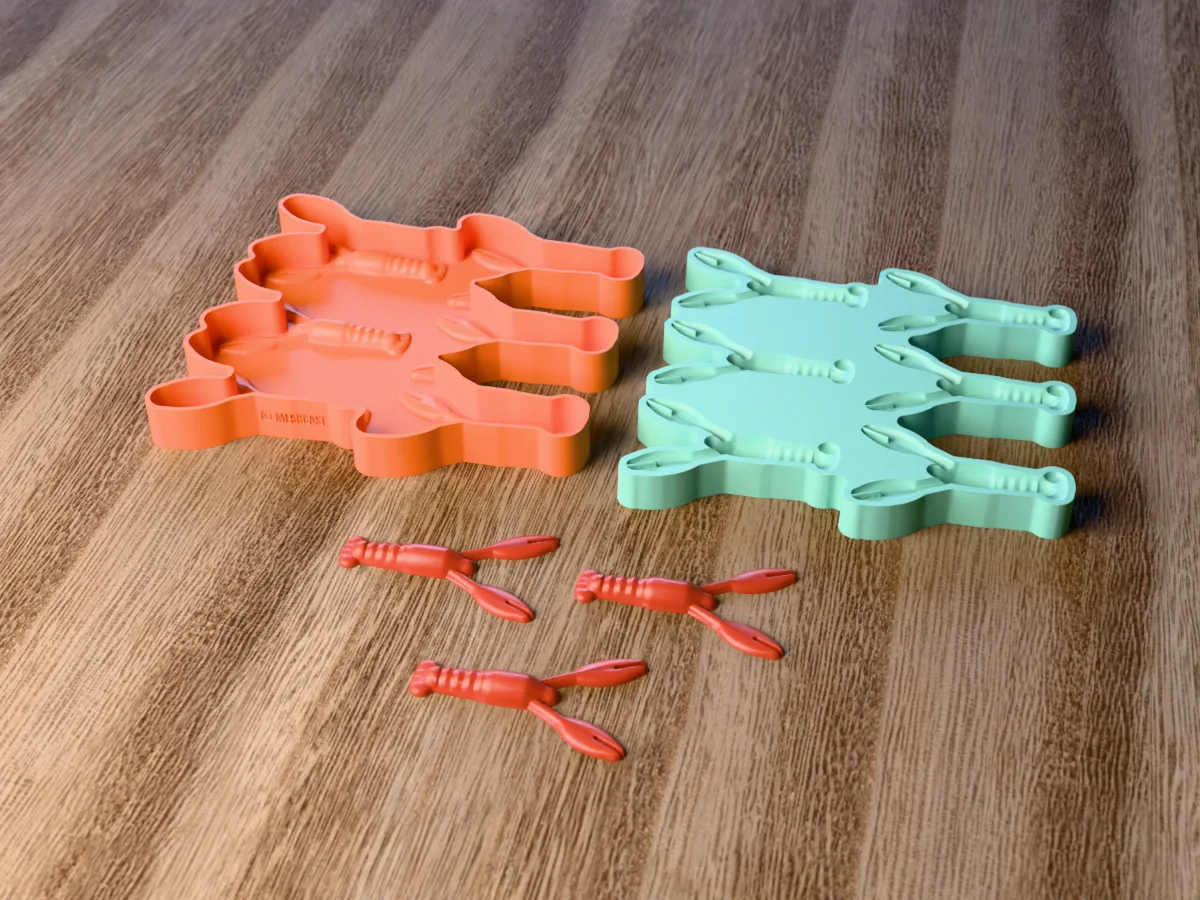 3D render of the printed caster for a six-cavity silicone craw lure mold beside the silicone mold it pours, with red soft plastic crawfish baits in front