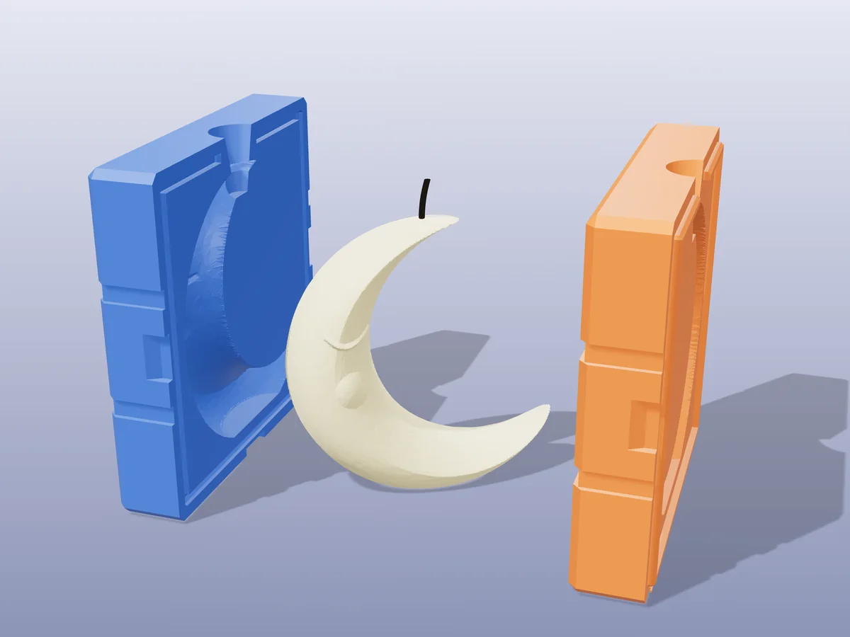 3D render of a pale yellow sleeping crescent moon candle between the two printed halves of its rigid blue and orange mold