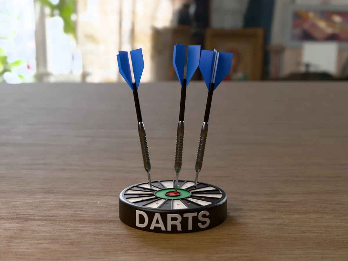 3D render, low view of the printed DARTS dart holder on a table, the name raised in white round the black case and three darts with blue flights standing in it