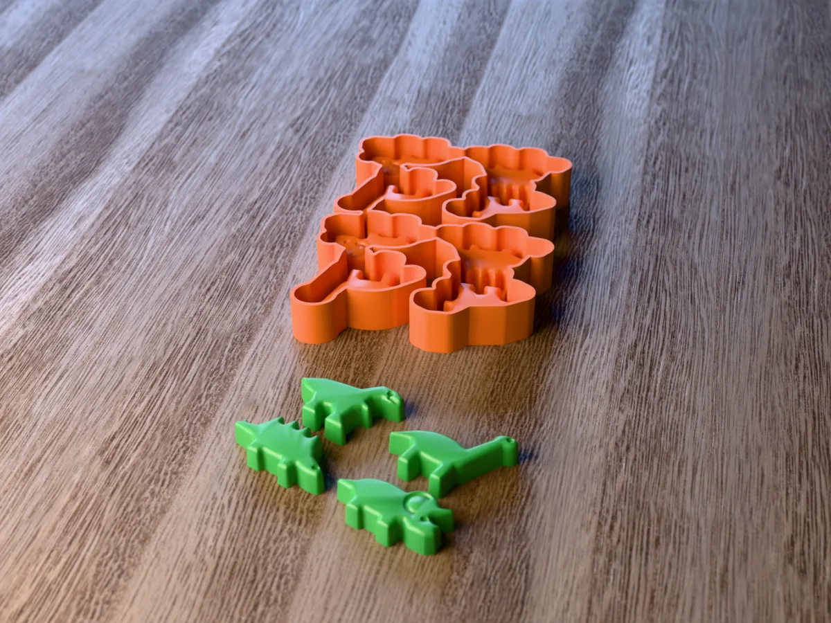 3D render of the printed caster for an eight-cavity dinosaur crayon mold, with four green crayons shaped like a T. rex, a long-neck, a stegosaurus and a triceratops in front