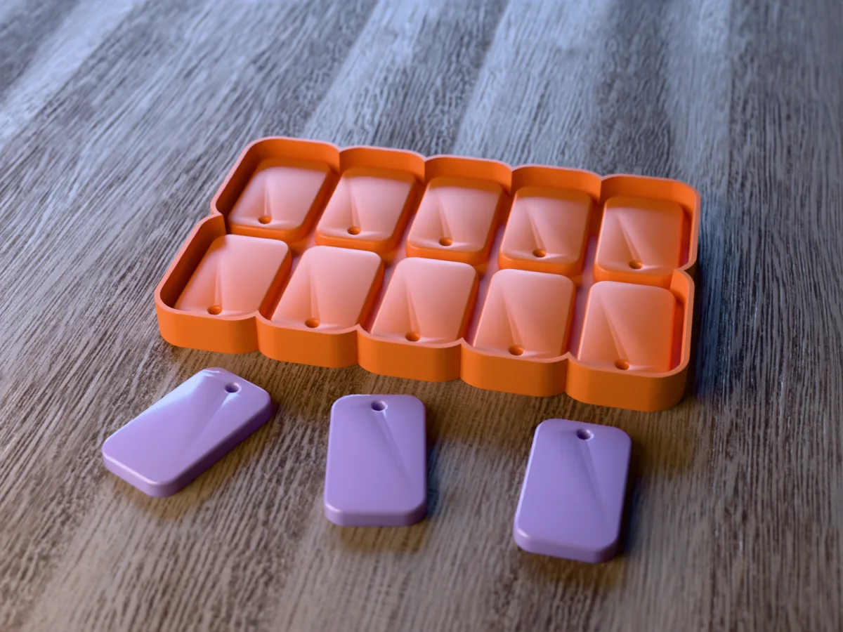 3D render of the printed caster for a ten-cavity dog tag resin keychain mold, with three glossy lilac rectangular resin keychain tags in front
