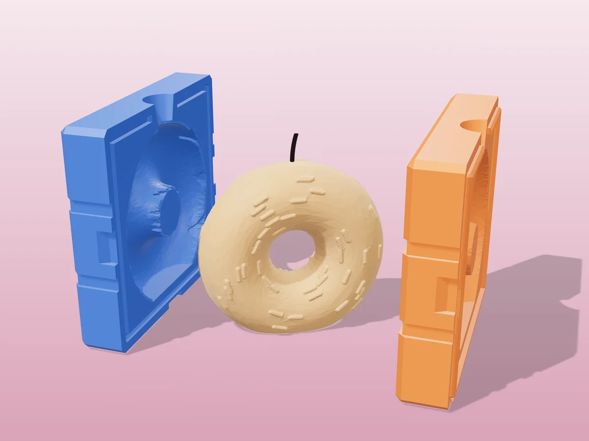 3D render of a frosted donut candle with sprinkles standing on its edge between the two printed halves of its rigid blue and orange mold