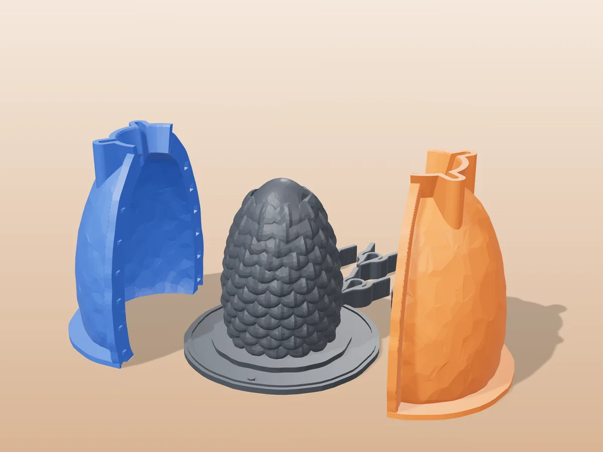 3D render of the scaled dragon egg master fused on its printed charcoal base, between the orange and blue hugging shell halves