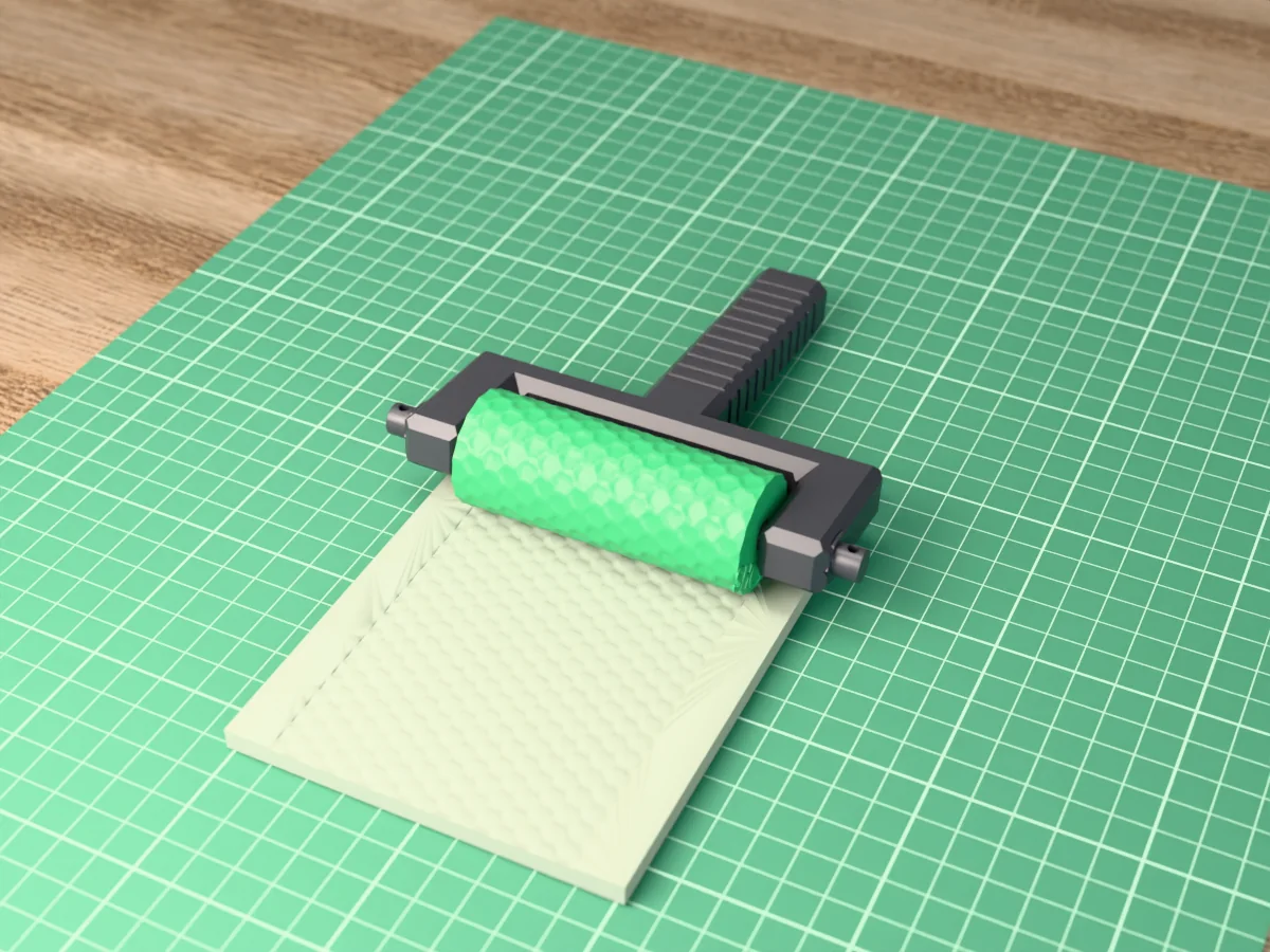 3D render of the printed dragon scale texture roller in its dark fork handle, resting on a slab of clay it has pressed with overlapping dragon scales
