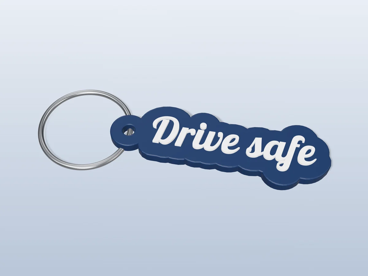 3D render of a navy blue and white 3D-printed Drive safe keychain with a steel split ring through its hole