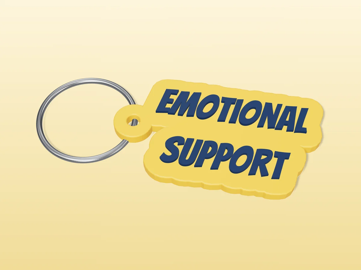 3D render of a yellow and navy blue 3D-printed Emotional support keychain with a steel split ring through its hole