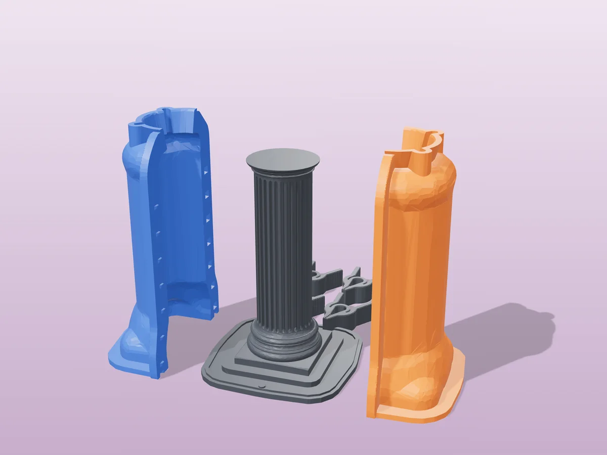 3D render of the fluted column master fused on its printed charcoal base, between the orange and blue hugging shell halves