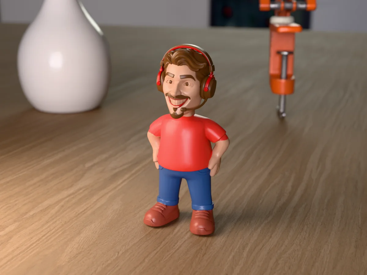 3D render of a 3D-printed mini figure of a grinning gamer in a red and black headset with a mic, painted in 6 colours, on a table