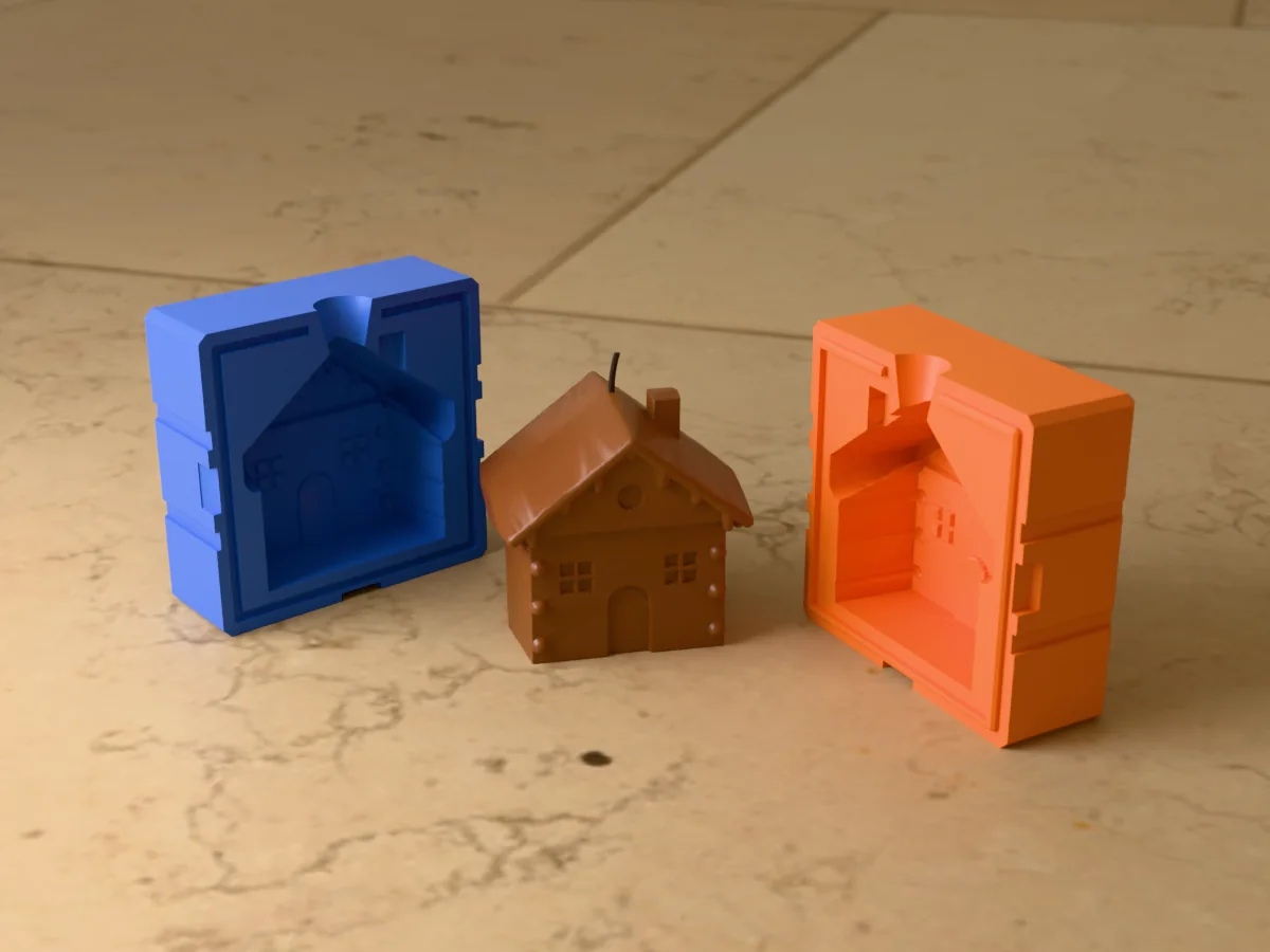 3D render of a brown gingerbread house candle with icing on the roof edges, a door and windows, between the two printed halves of its rigid two-part mold