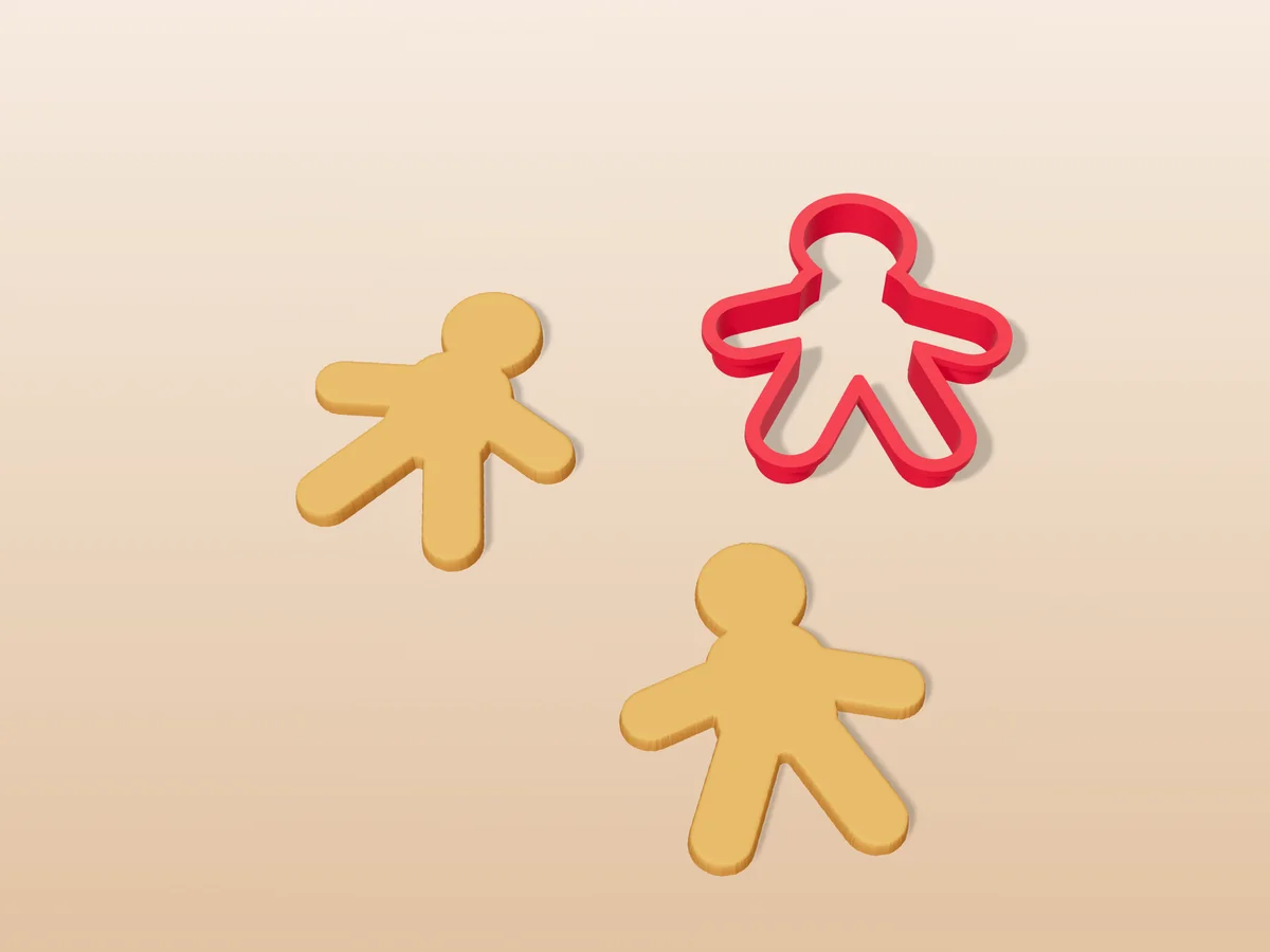 3D render of a red 3D-printed gingerbread man cookie cutter next to two golden baked cookies in the same shape