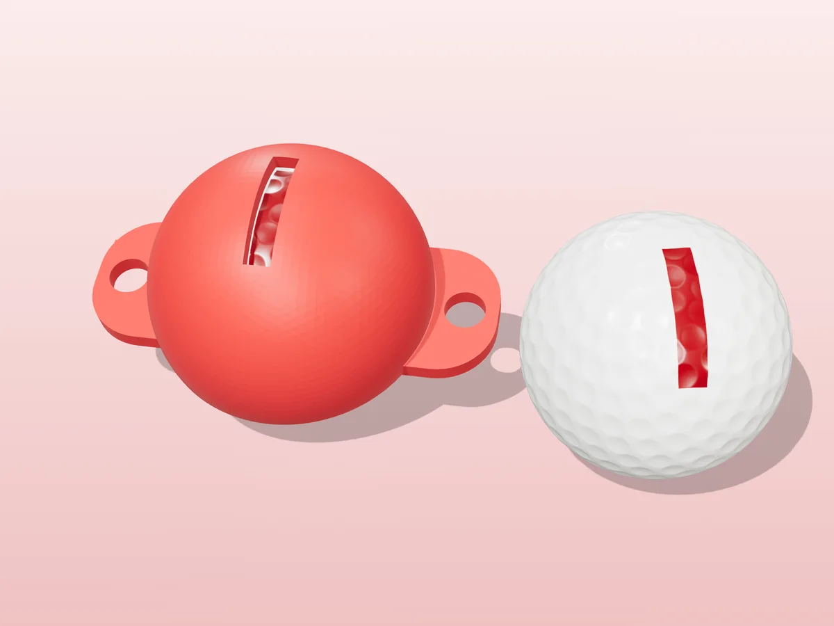 3D render of a red 3D-printed golf ball stencil with the letter I cut through it, sitting on a golf ball, next to a ball marked with a red I