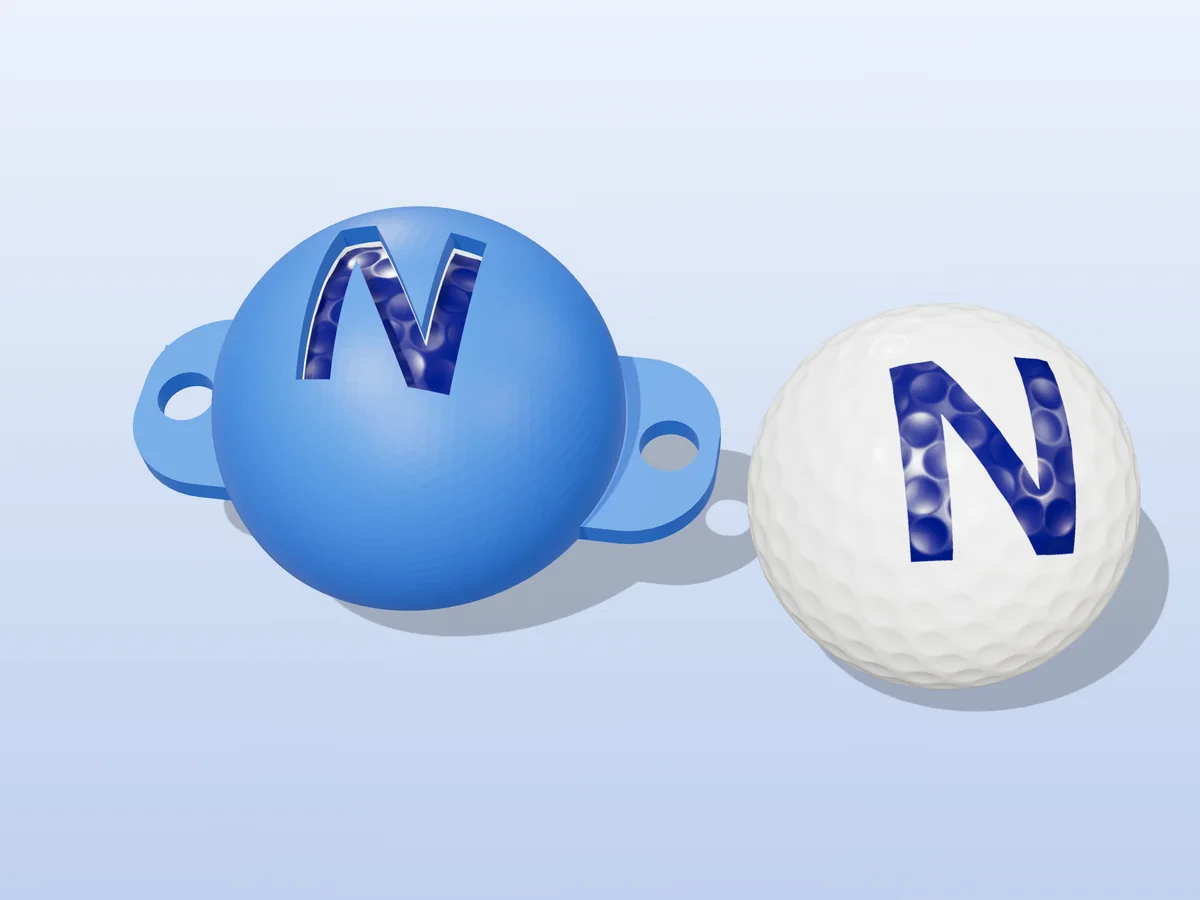 3D render of a blue 3D-printed golf ball stencil with the letter N cut through it, sitting on a golf ball, next to a ball marked with a blue N