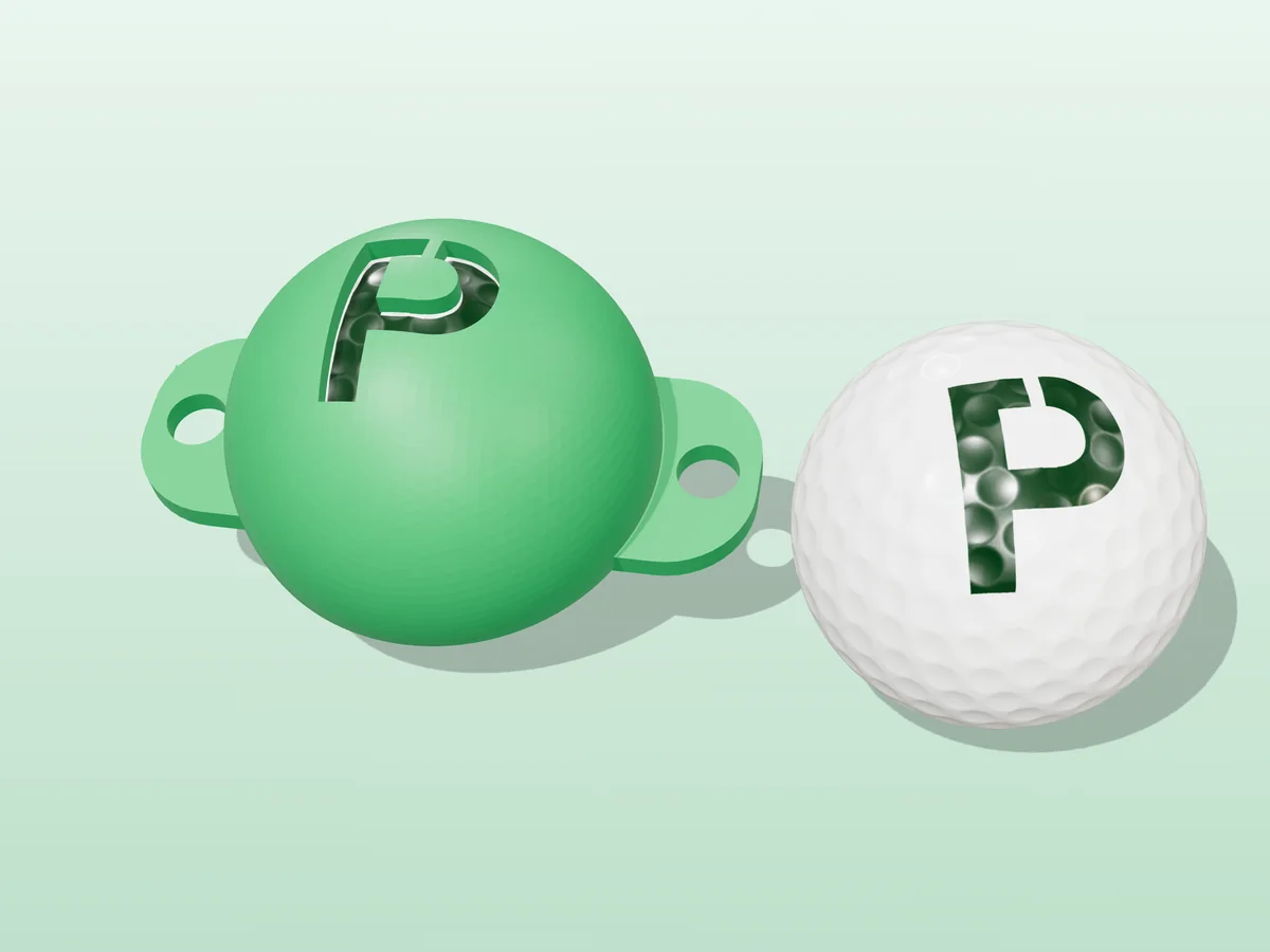 3D render of a green 3D-printed golf ball stencil with the letter P cut through it, sitting on a golf ball, next to a ball marked with a green P