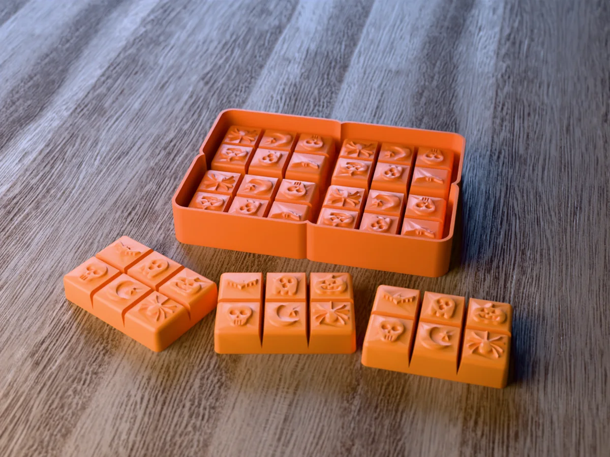 3D render of the printed caster for a four-bar silicone Halloween snap bar tray, with three orange wax melt snap bars with bat, ghost, pumpkin, skull, moon and spider icons in front