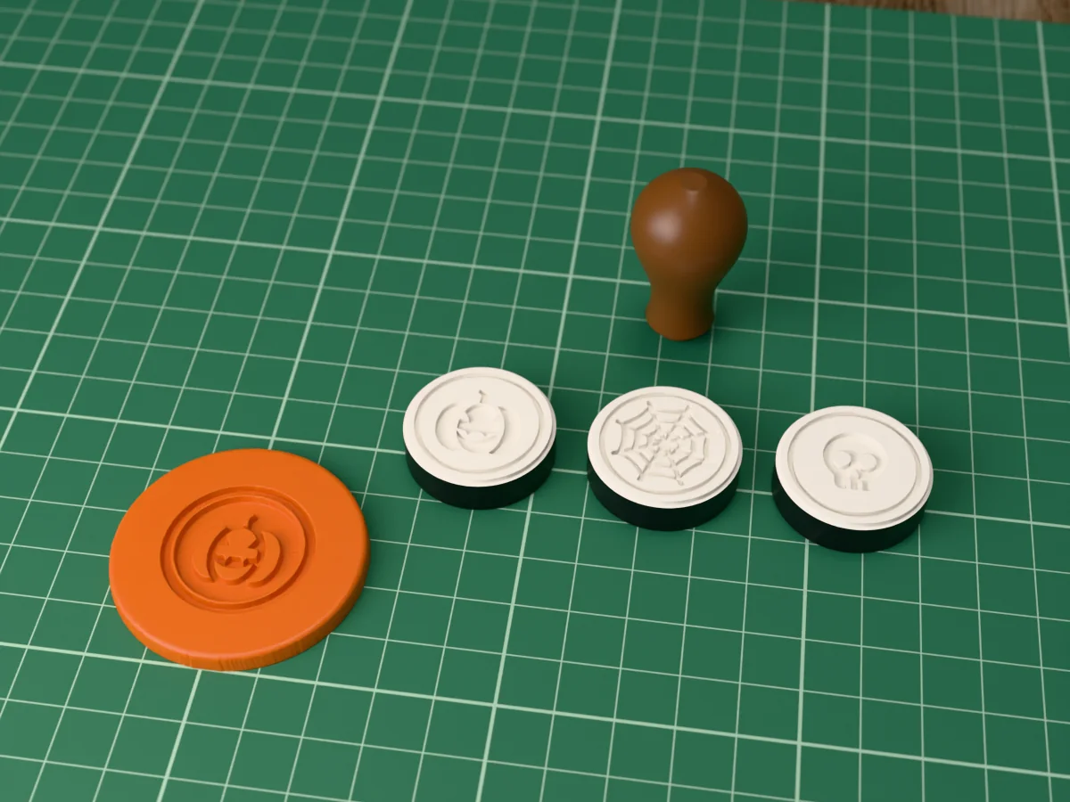 3D render of printed wax seal stamp plates with a jack-o'-lantern pumpkin, a spider web and a skull, face up beside their brown handle, and a round wax seal pressed with a jack-o'-lantern pumpkin