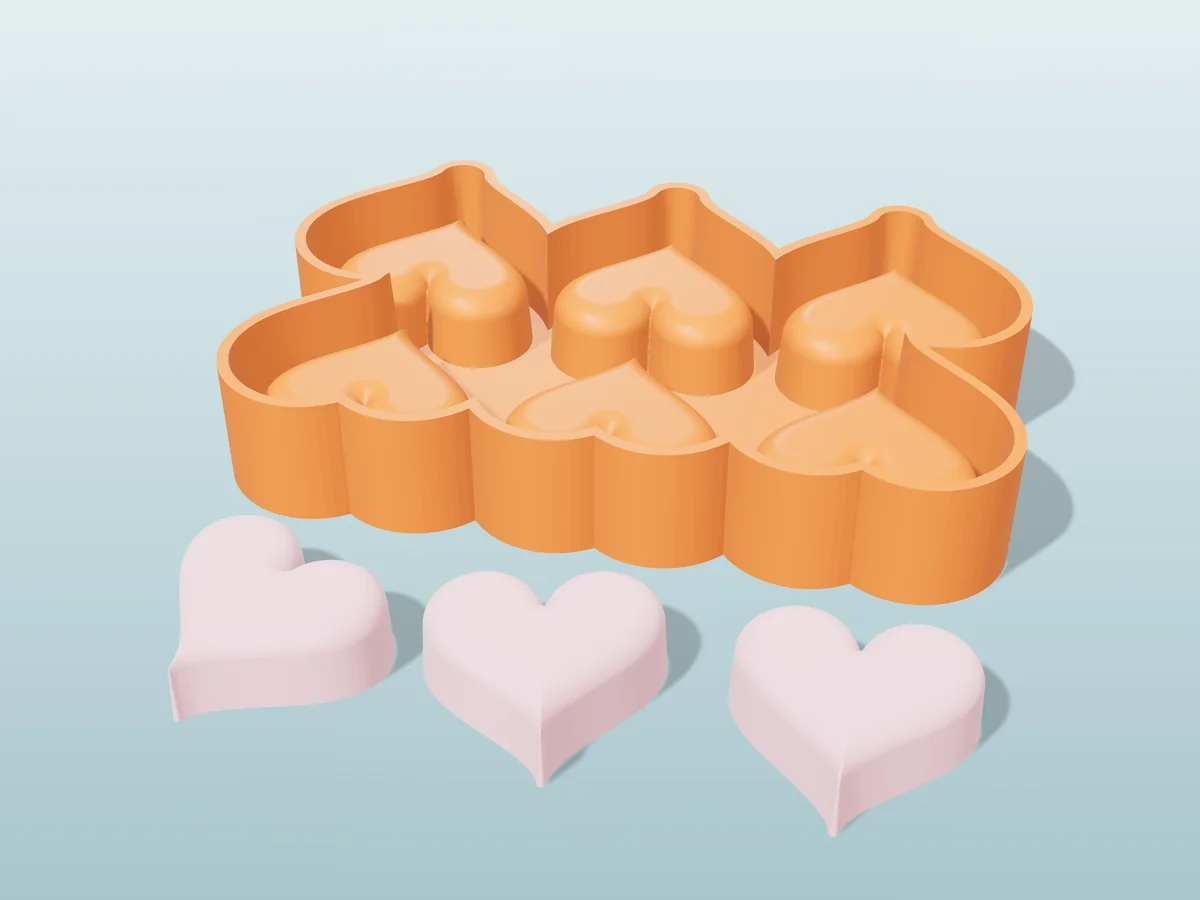 3D render of the printed caster for a six-heart silicone wax melt tray, with three pink heart wax melts in front