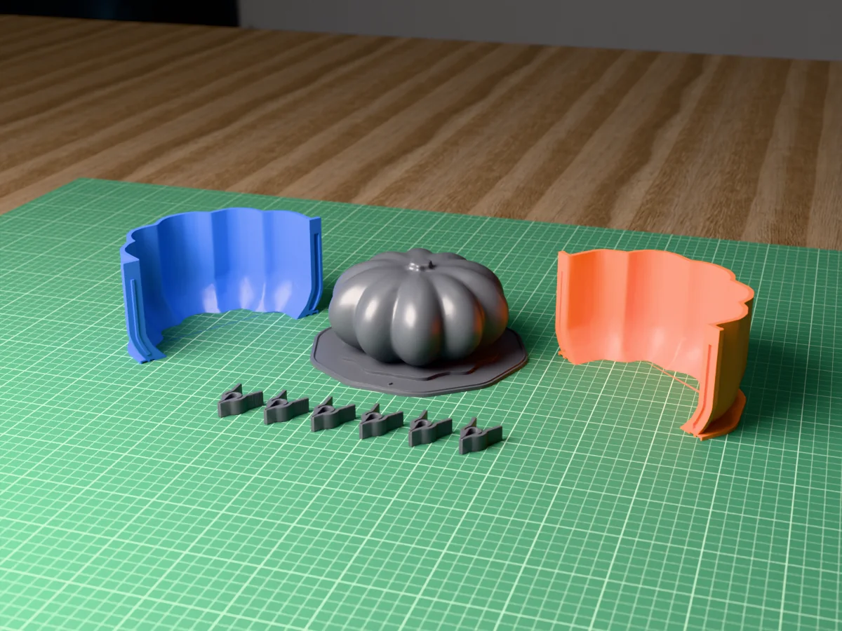 3D render of the squat heirloom concrete pumpkin master with deep lobes and a short stem, fused on its printed charcoal base between the orange and blue shell halves, with the charcoal clamps in front