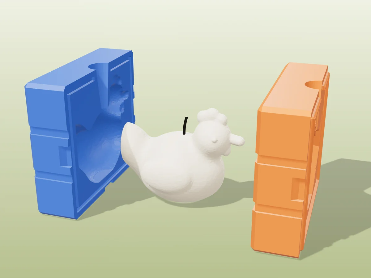 3D render of a cream sitting hen candle with a comb and beak between the two printed halves of its rigid blue and orange mold